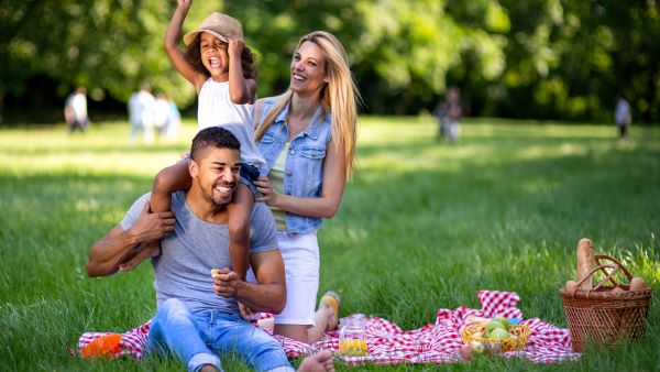 Family of three having a picnic Family of three having a picnic