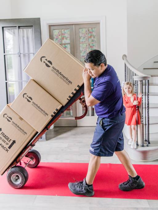 Man moving boxes out of home