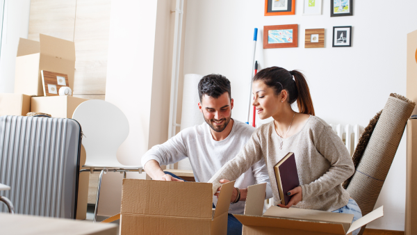 Couple unpacking boxes